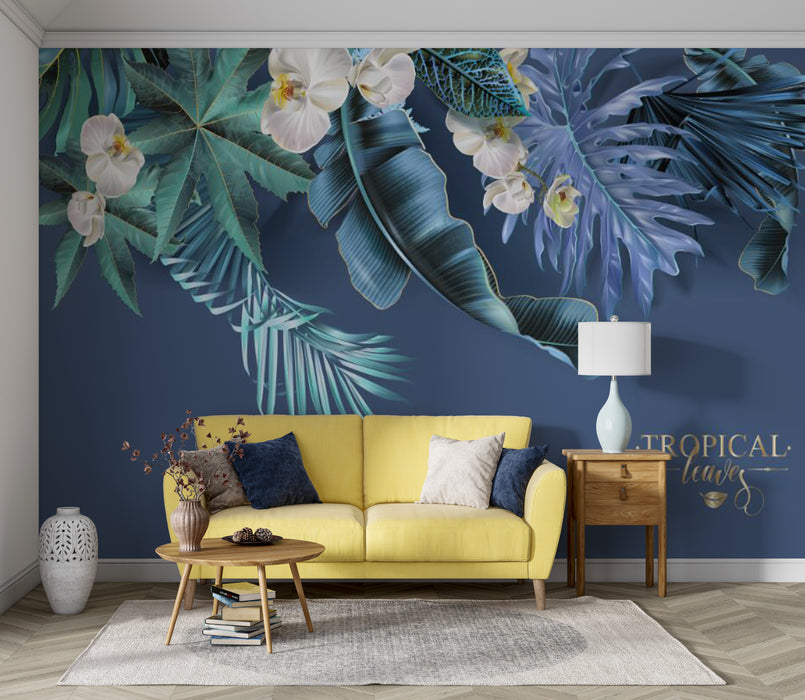 The wallpaper features lush green tropical plants with wide and vibrant leaves